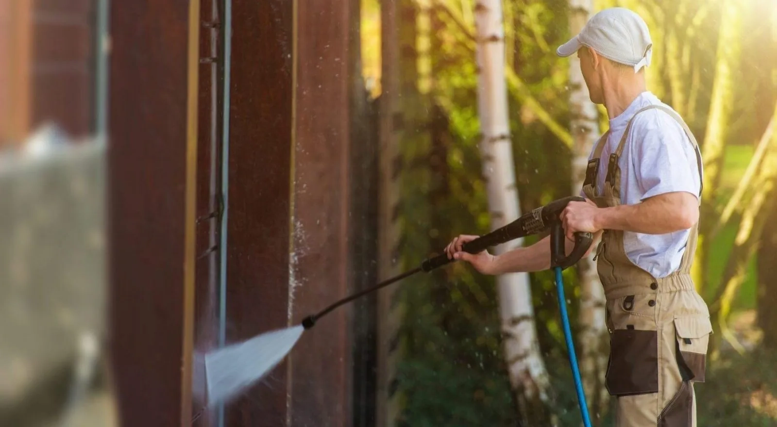 Soft washing a house